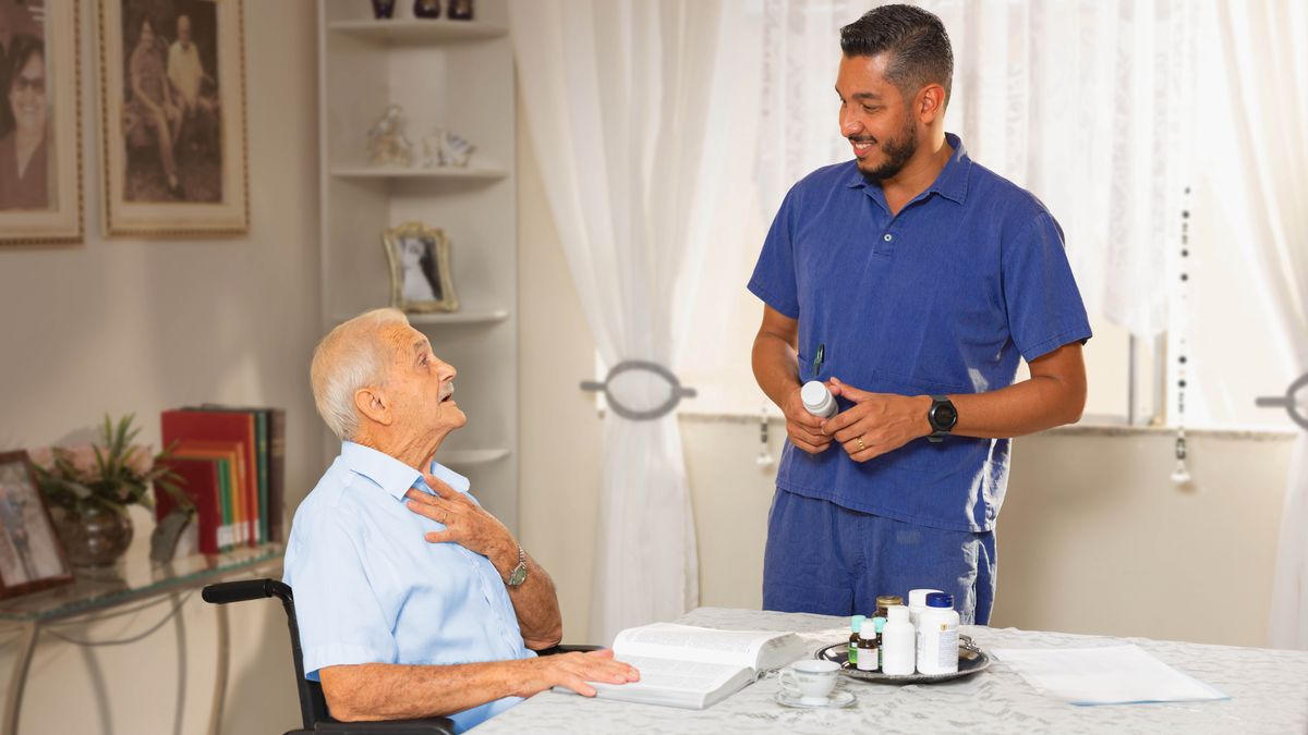 An elderly brother in a wheelchair, witnessing to his caregiver.