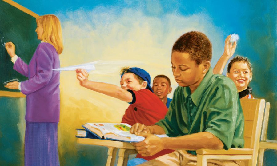 ’n Seun leer by die skool terwyl sy klasmaats hulle sleg gedra