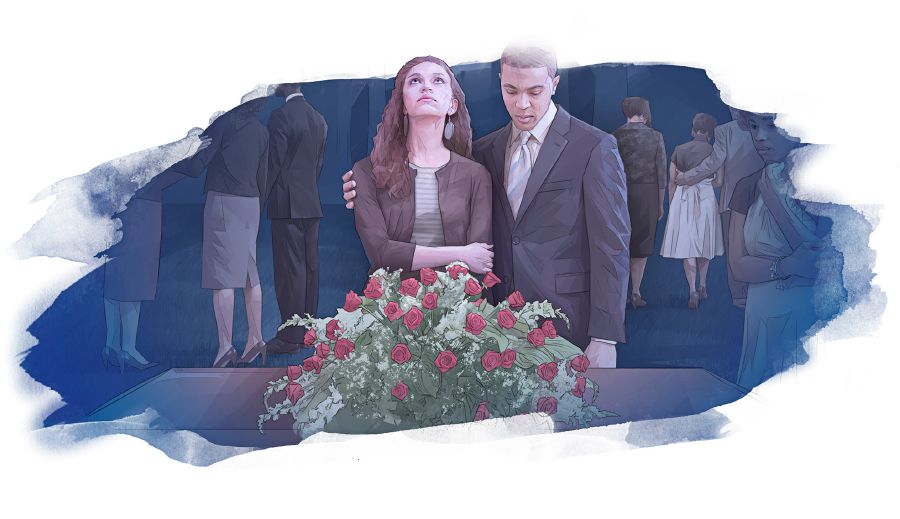 زوجان متفجِّعان يقفان امام تابوت مغلق