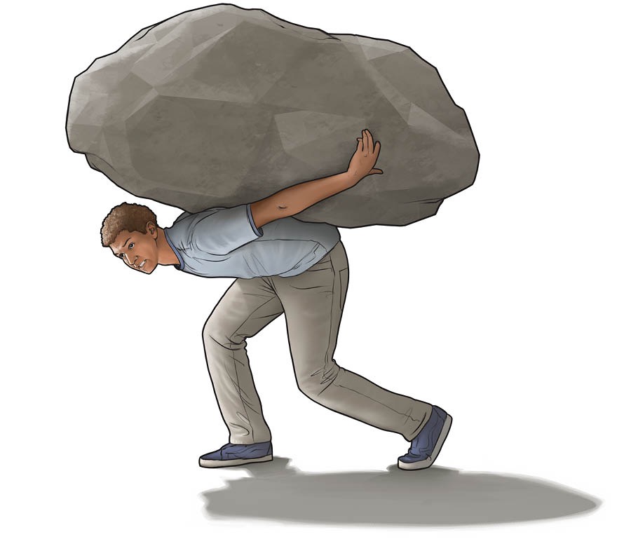 A teenage boy carrying a huge rock on his back.