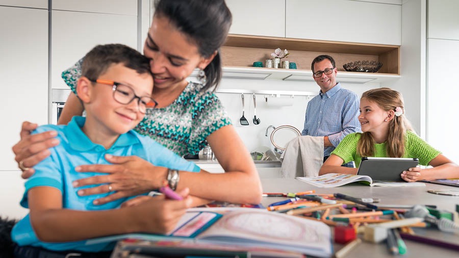 A father and mother spending time together with their young son and daughter.