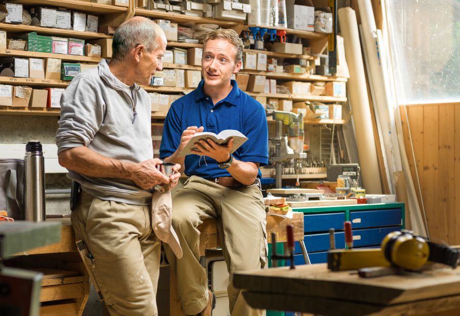 A brother witnesses to a man at work