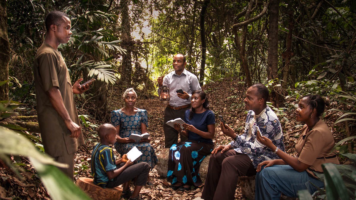 During the great tribulation, a small group of Witnesses holds a congregation meeting in a forest