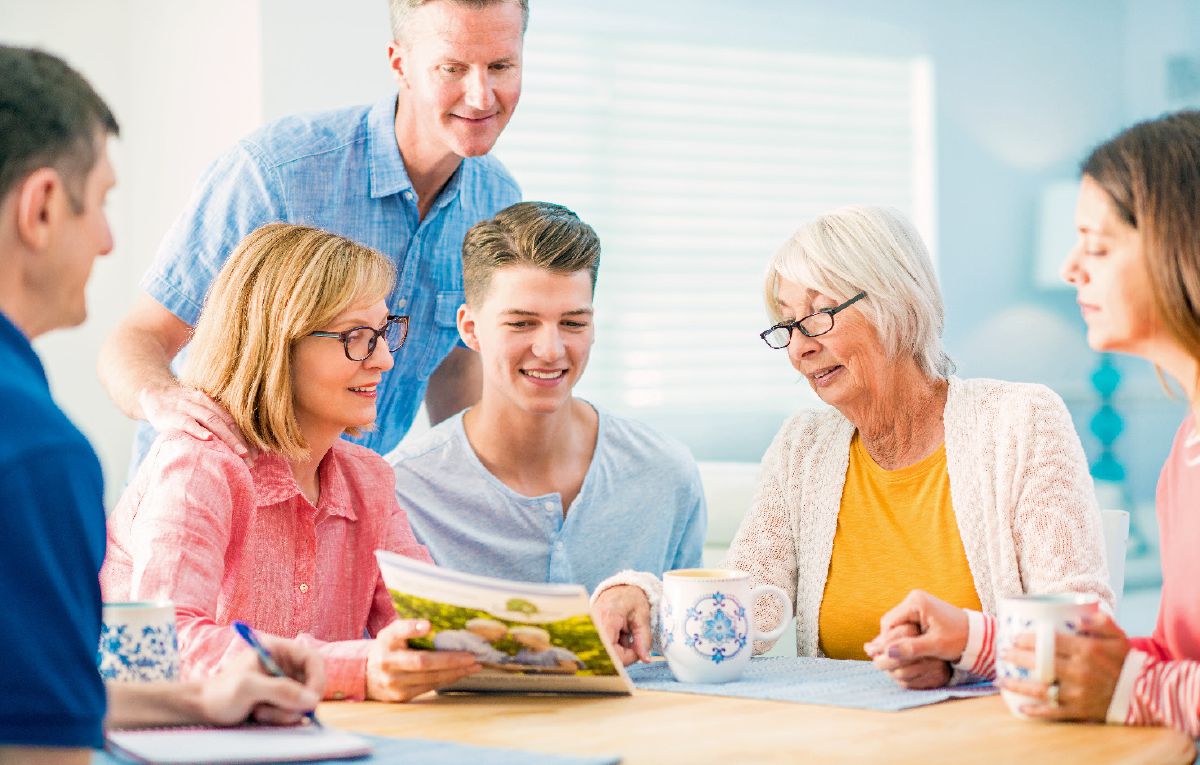 An elderly woman meets with her family to discuss her care