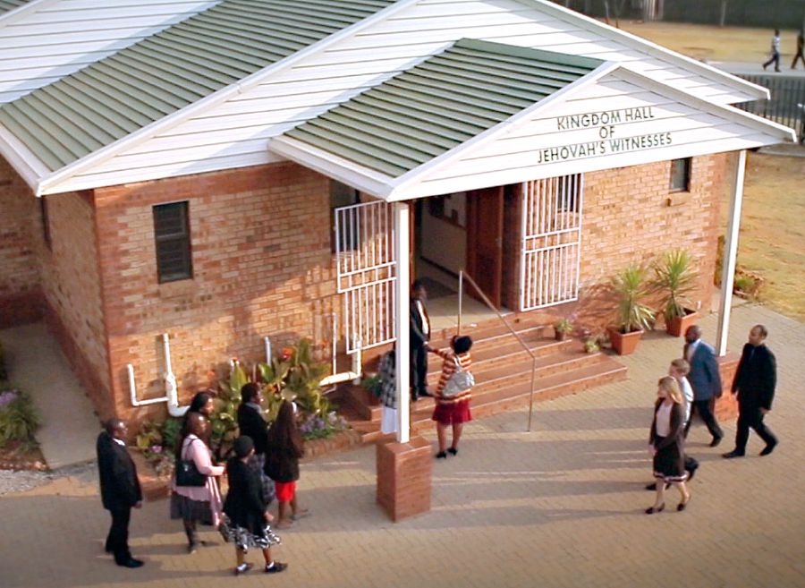 Jehovah’s Witnesses enter a Kingdom Hall