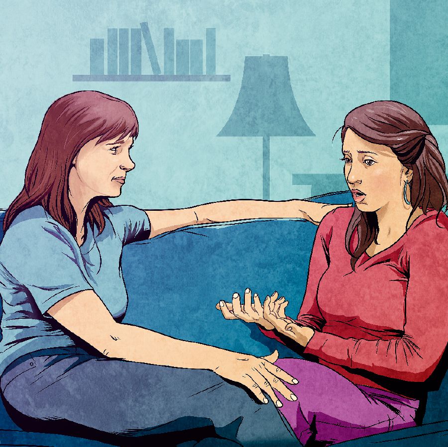 A young woman talks to a friend