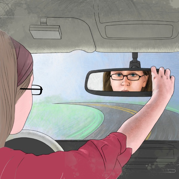 Wan gel i stap draevem wan trak mo i stap lukluk hem long glas blong trak