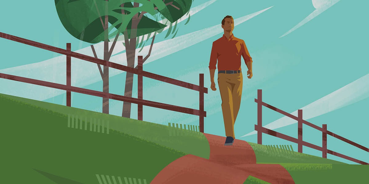 Um homem andando por um caminho