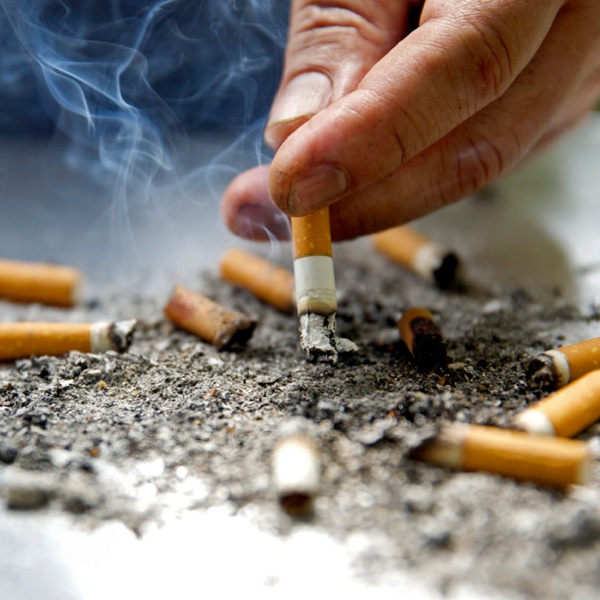 A person putting out a cigarette