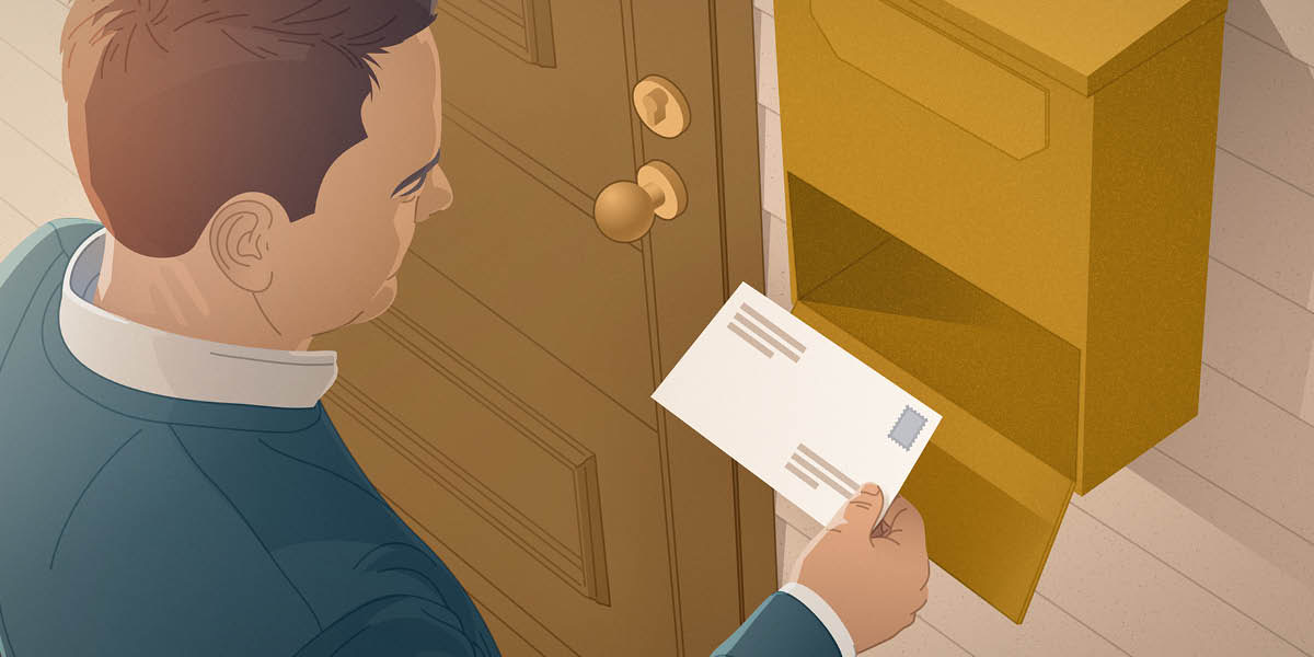 A man standing at his mailbox, holding a handwritten letter he received in the mail.