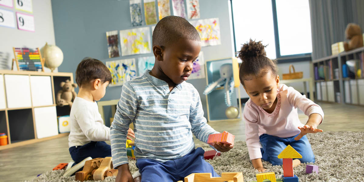 Children playing with toys at a day-care center.