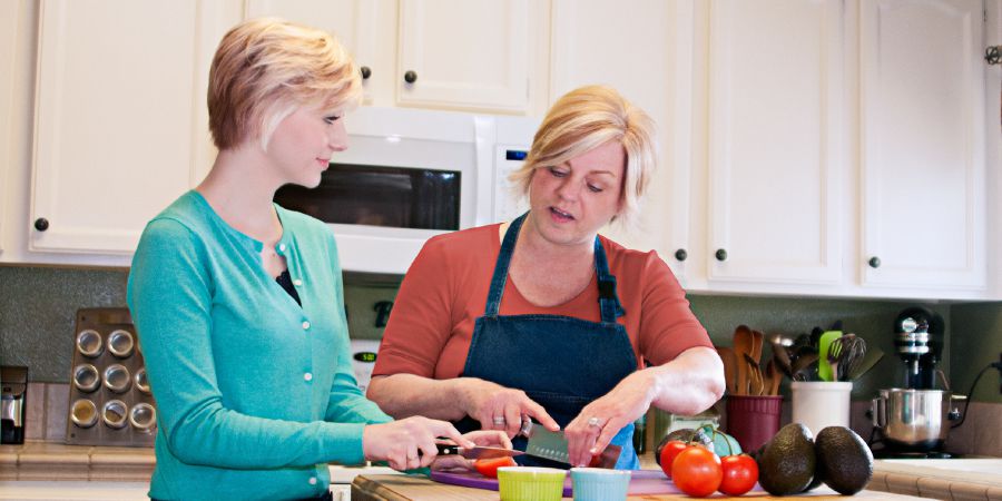 Emmaline and her mother work together in the kitchen