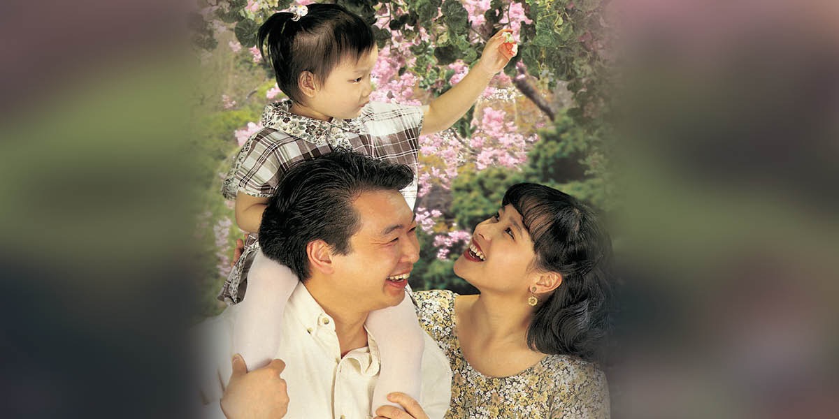 A couple with their little girl