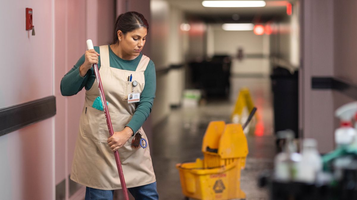 The single mother cleaning in an office building at night.