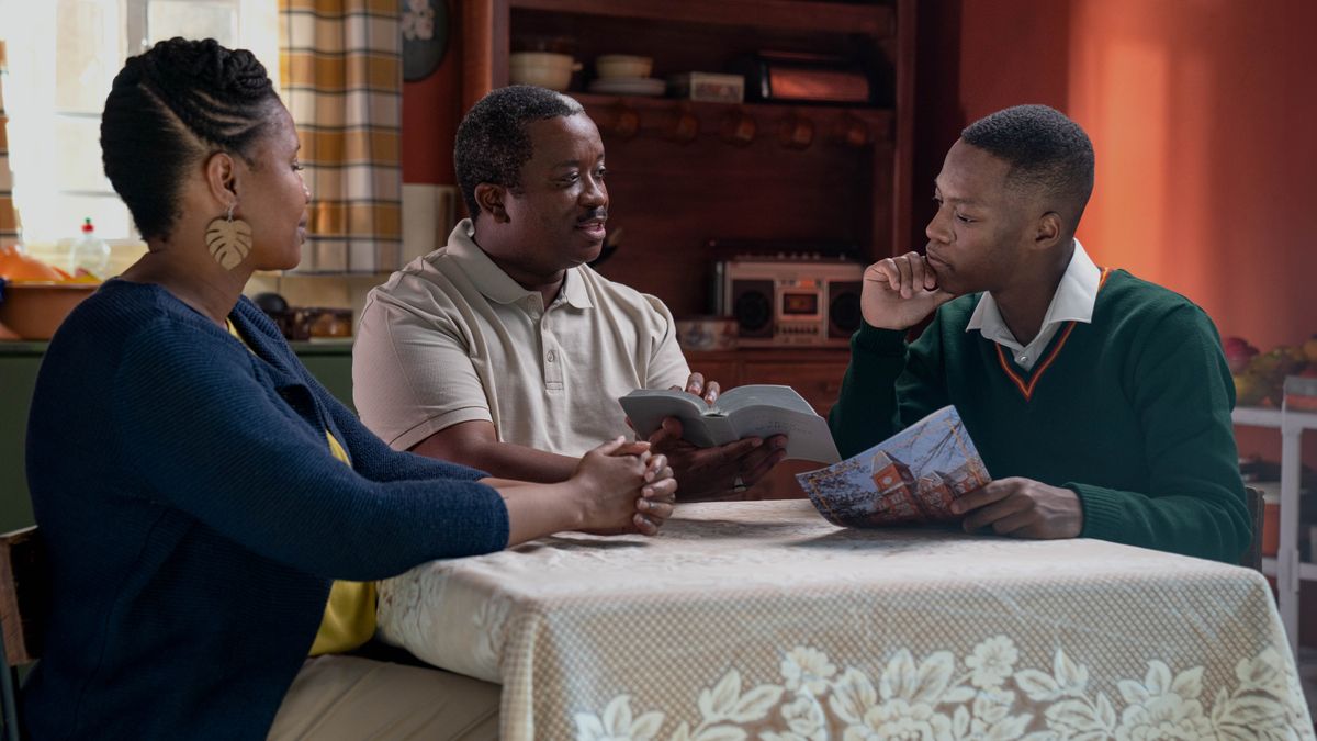 The brother speaks with his parents at home about the brochure he received. They reason with him from the Scriptures.