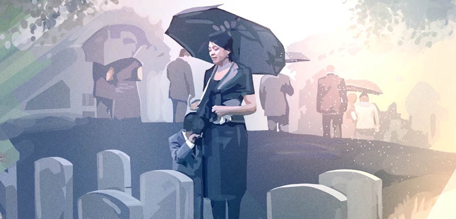 Des personnes en deuil dans un cimetière
