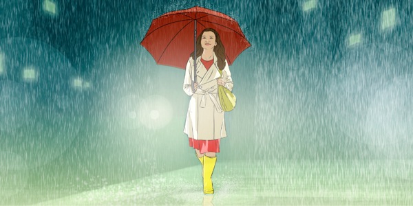 Une adolescente marche sous la pluie