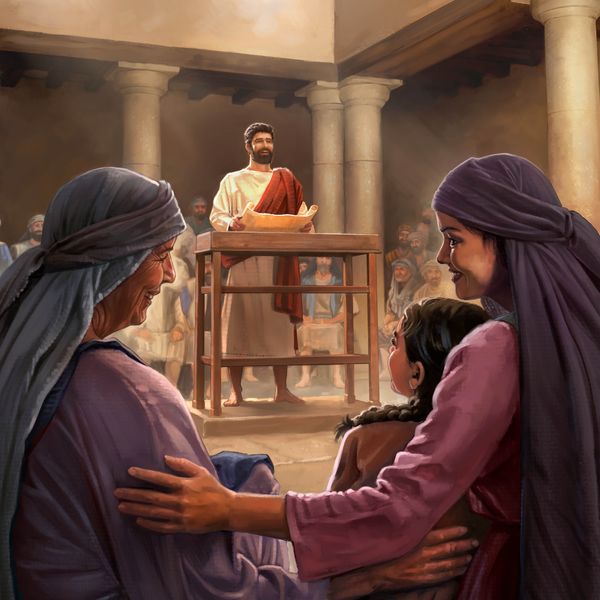 Dans une synagogue, Jésus, un rouleau ouvert dans les mains, parle devant un auditoire composé d’hommes, de femmes et d’enfants qui écoutent attentivement.