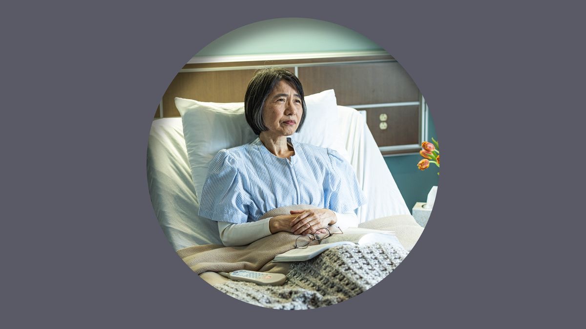 A sister sitting up in a hospital bed with an open Bible on her lap.