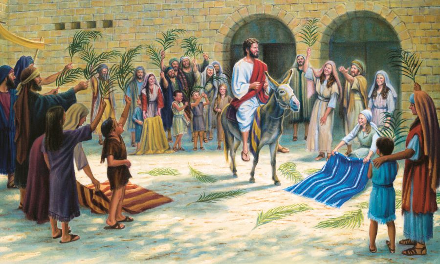 Jesús oike ohóvo Jerusalénpe peteĩ vúrro ári, umi hénte oipyso pe yvýpe ijao joʼaha ha palméra rakã