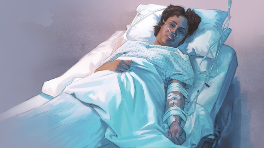 אישה שוכבת במיטת בית חולים עם אינפוזיה ביד וצינור חמצן באף.‏