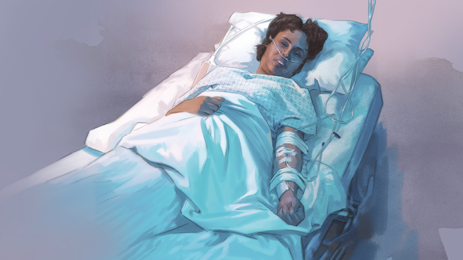 אישה שוכבת במיטת בית חולים עם אינפוזיה ביד וצינור חמצן באף.‏