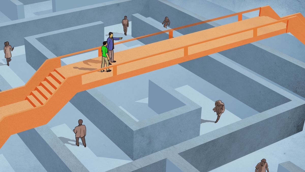 One guy follow anodda guy on one bridge dat go ova one maze. Odda peopo unda da bridge walk aroun inside da maze.