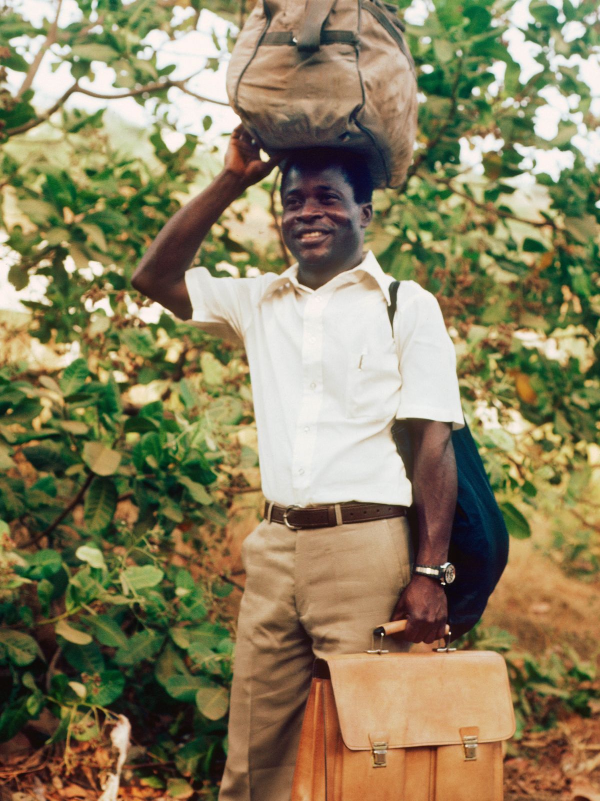 Israel is happy carrying all his stuffs.