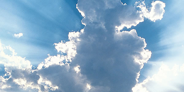 Bright sunlight shining behind clouds