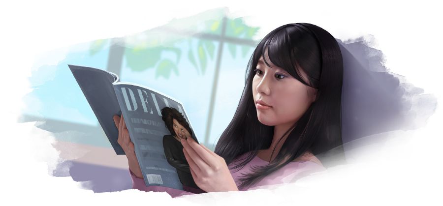 1人の若い女性がファッション誌を見ている