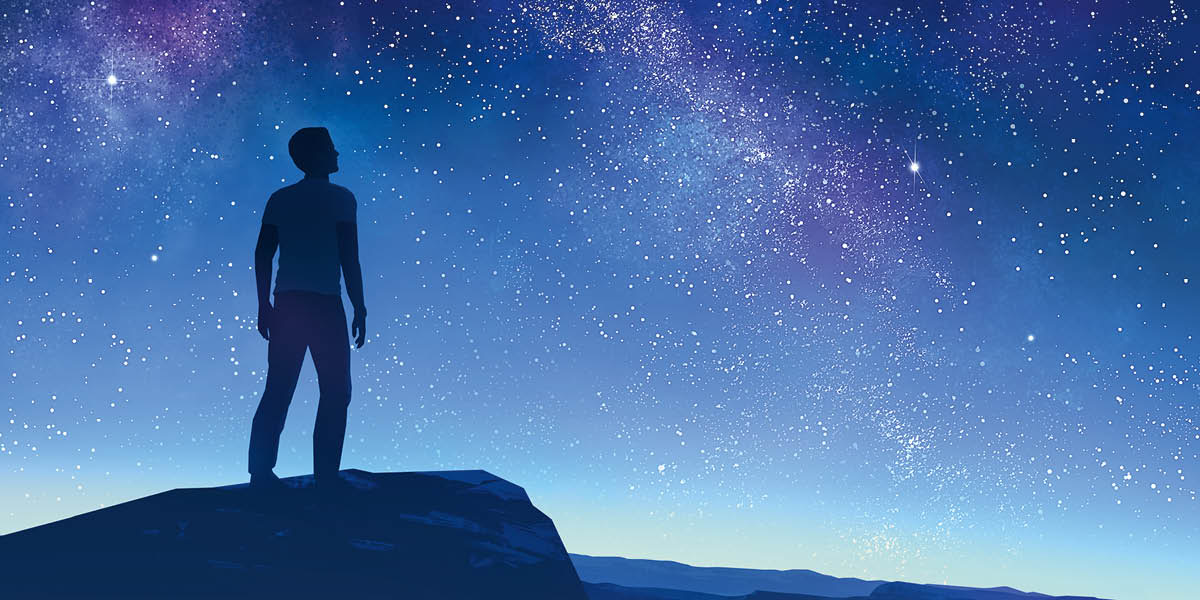 満天の星を見上げる人