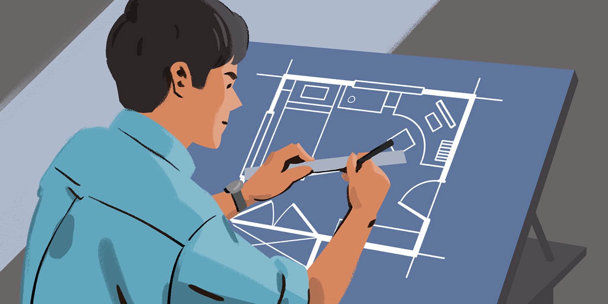 青年が，設計図を描いている。