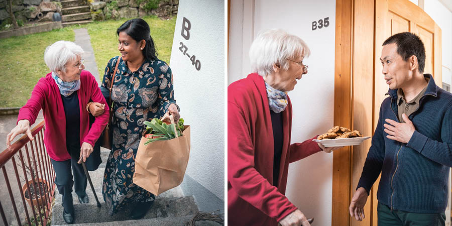 1. 白人の年配の女性がインド人の女性に荷物を持ってもらい，階段を上るのを助けてもらっている。2. その白人の女性が，近所に住む先ほどのアジア人の男性にクッキーを届けている。