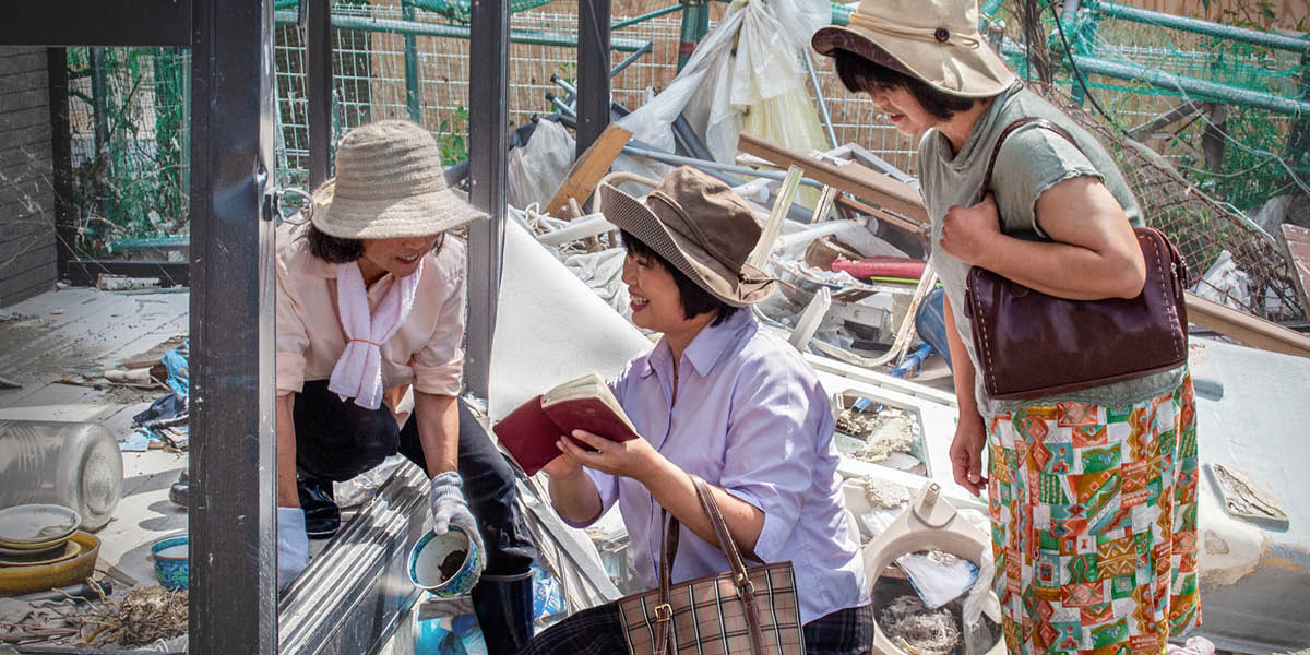 Two sisters preaching to the woman who cleaning her house after the earthquake.