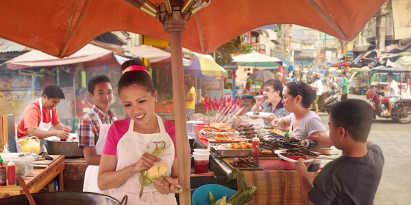 Marilyn’s family working at a food stand to support themselves financially