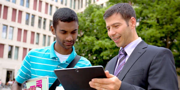 A Witness named Brian showing the jw.org website to a man named Eric