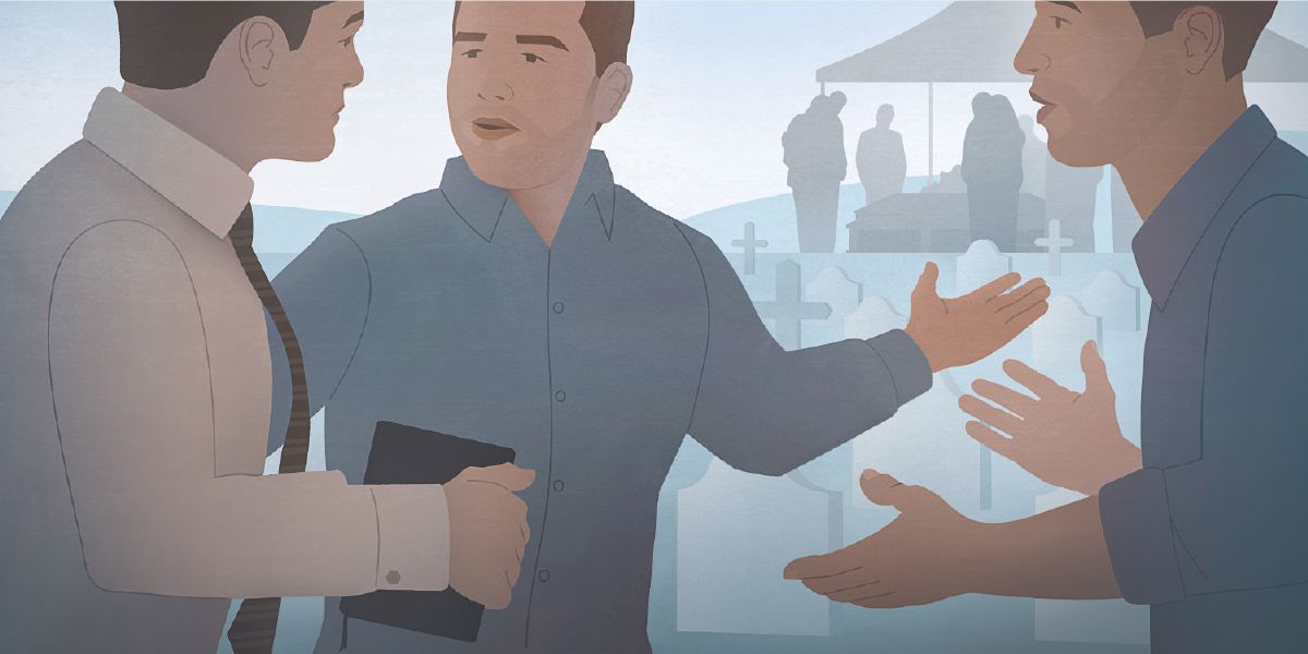 To menn på en kirkegård snakker med et Jehovas vitne. En av mennene gjør en gest mot en begravelse som foregår i bakgrunnen.