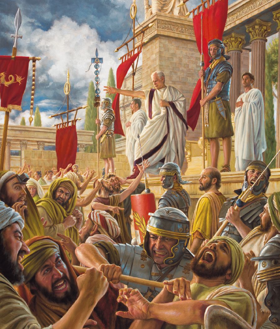 Galio no a ni trata Pablo su kaso miéntras ku e tabata pará dilanti e akusadonan di Pablo ku tabata furioso. Sòldá romano tabata purba di kontrolá e multitut di hende ku tabata masha rabiá.