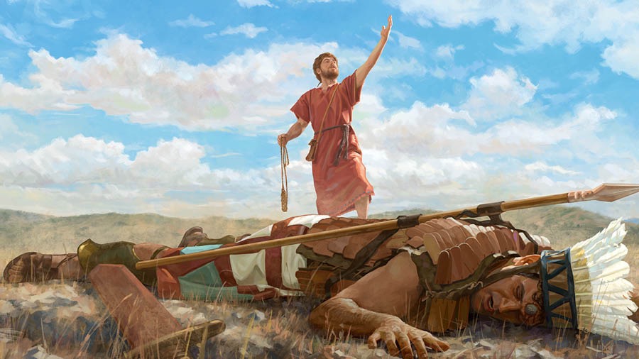 Goliat drumí boka abou riba suela ku un piedra den su frenta. David ta para over di Goliat, ku un slengu den un man i ta hisa e otro man pa alabá Yehova.