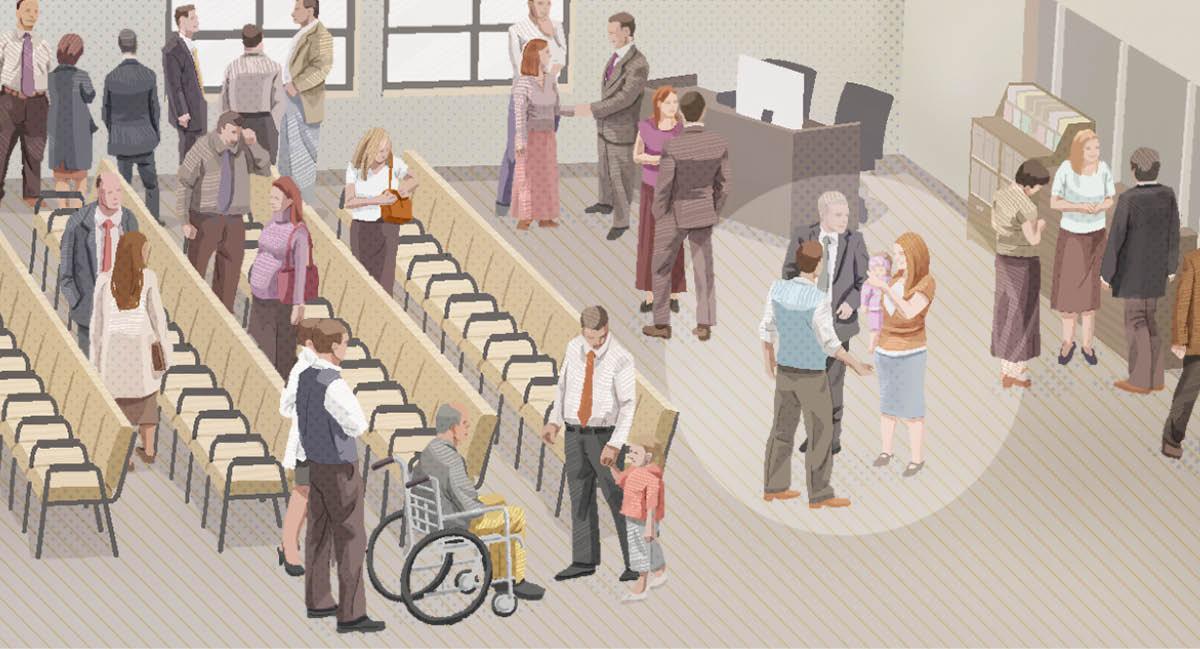 D. A male Witness talking with a family after a meeting.