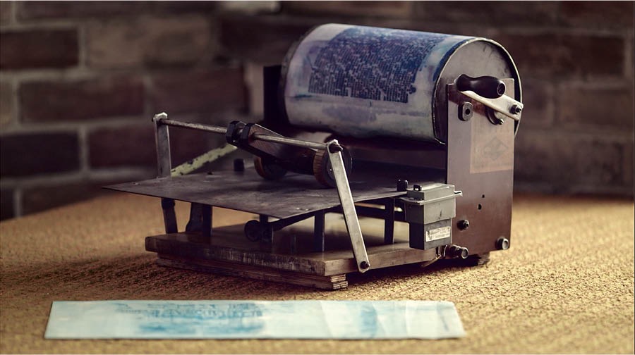 Collage: Scenes from the video ‘Maintaining Unity Under Ban.’ 1. A map showing the countries that were under ban in Eastern Europe. 2. A mimeograph machine. 3. Romanian brothers hugging one another.