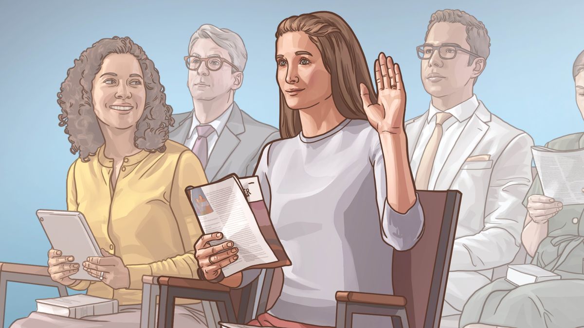 Uma irmã levanta a mão para comentar numa reunião.