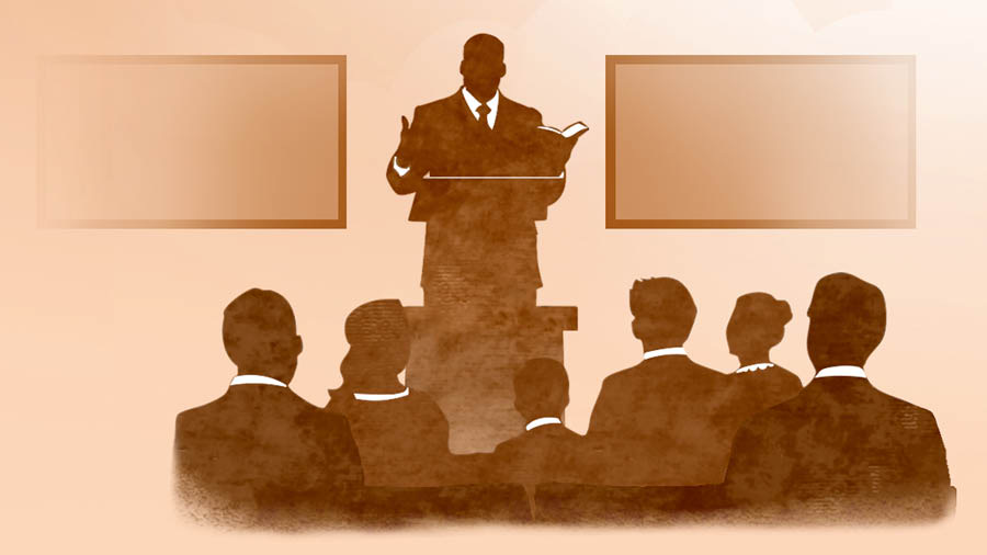 Um ancião faz um discurso numa reunião.