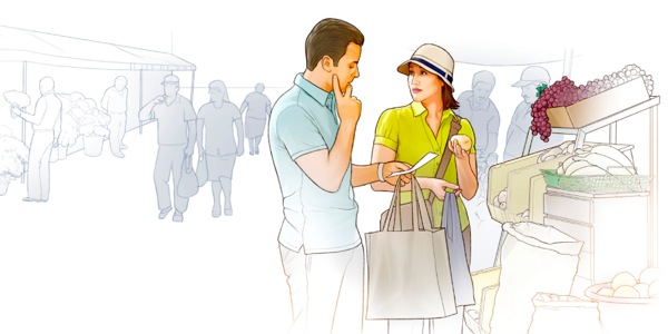 Um casal consulta uma lista ao fazer compras