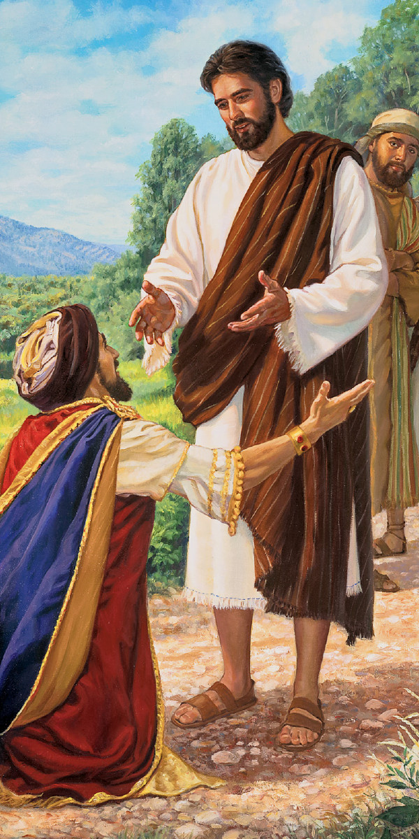 Um jovem líder rico de joelhos fazendo uma pergunta para Jesus.