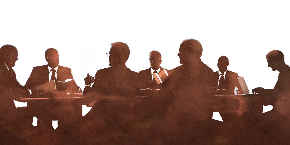 Membros de uma comissão do Corpo Governante e seus ajudantes em uma reunião.