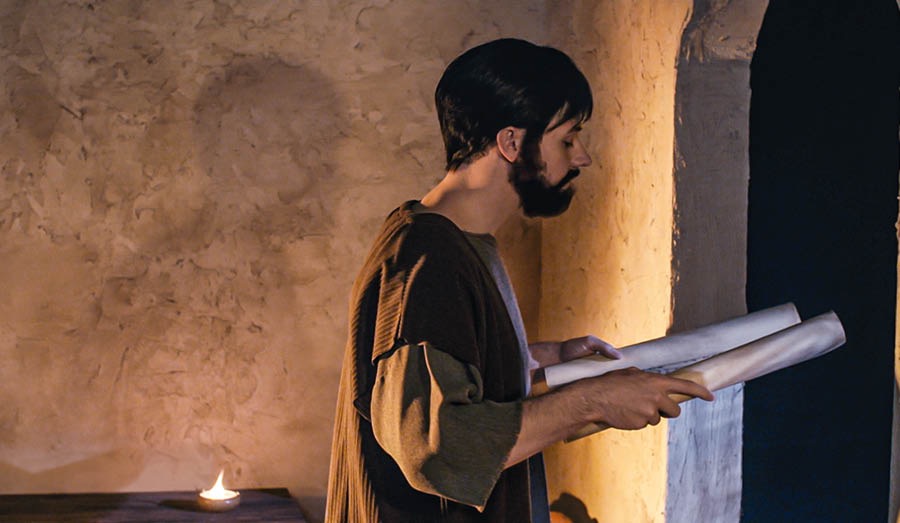 Timothy de read this scroll for mid night and e stand near window.