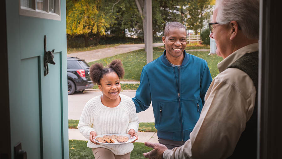 One brother and e young daughter de bring small chop-chop for one old brother for e house.