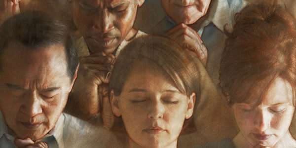 People from different backgrounds praying